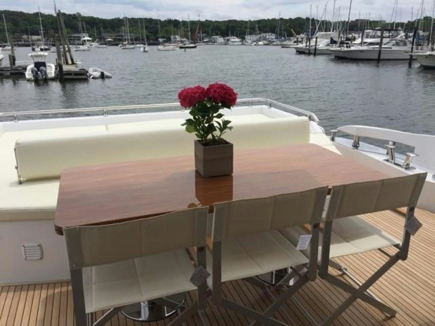 a table with flowers on it aboard SILVER SKY 2.0 Yacht for Sale