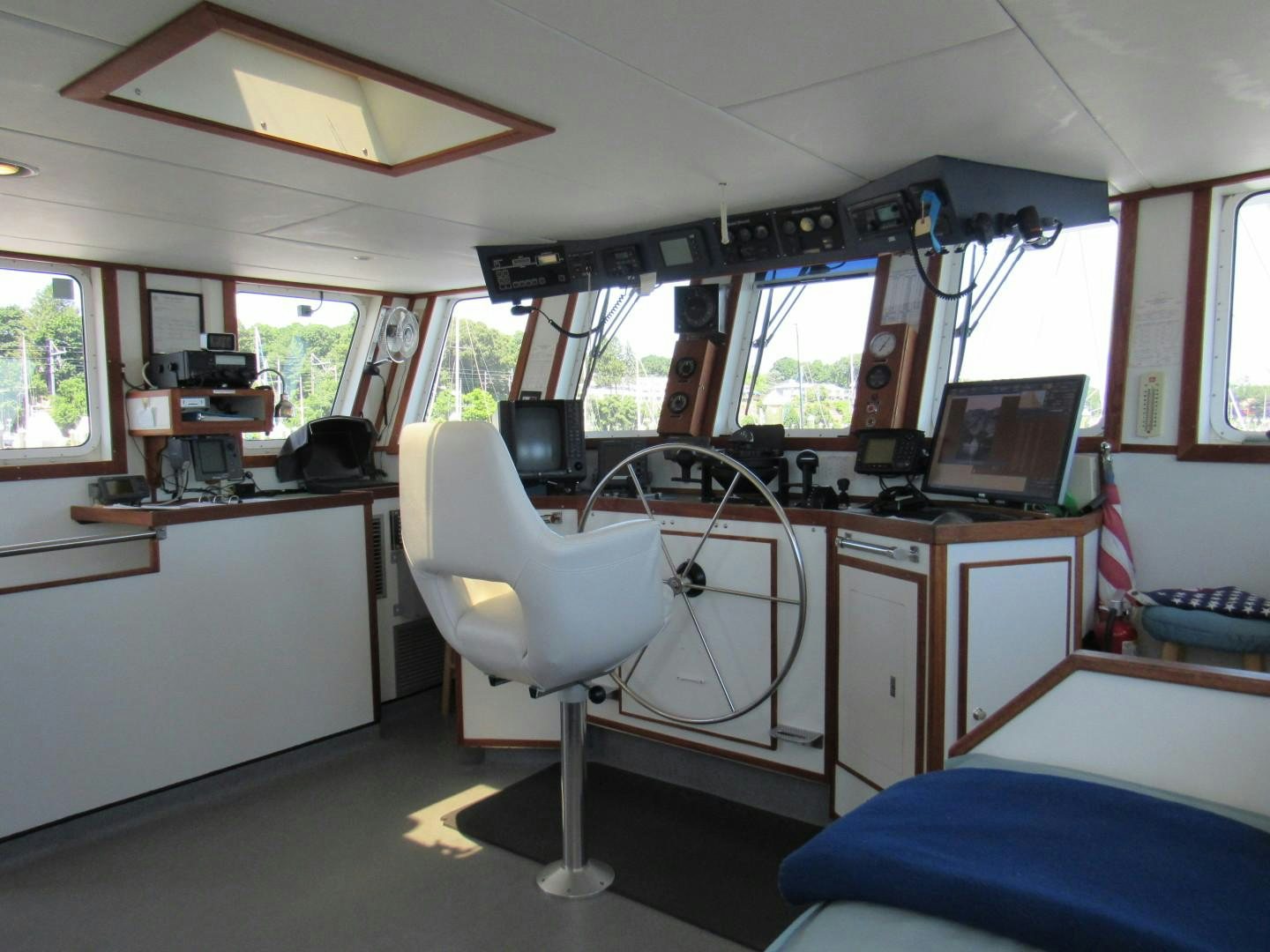 a room with a desk and a computer aboard KITTIWAKE Yacht for Sale