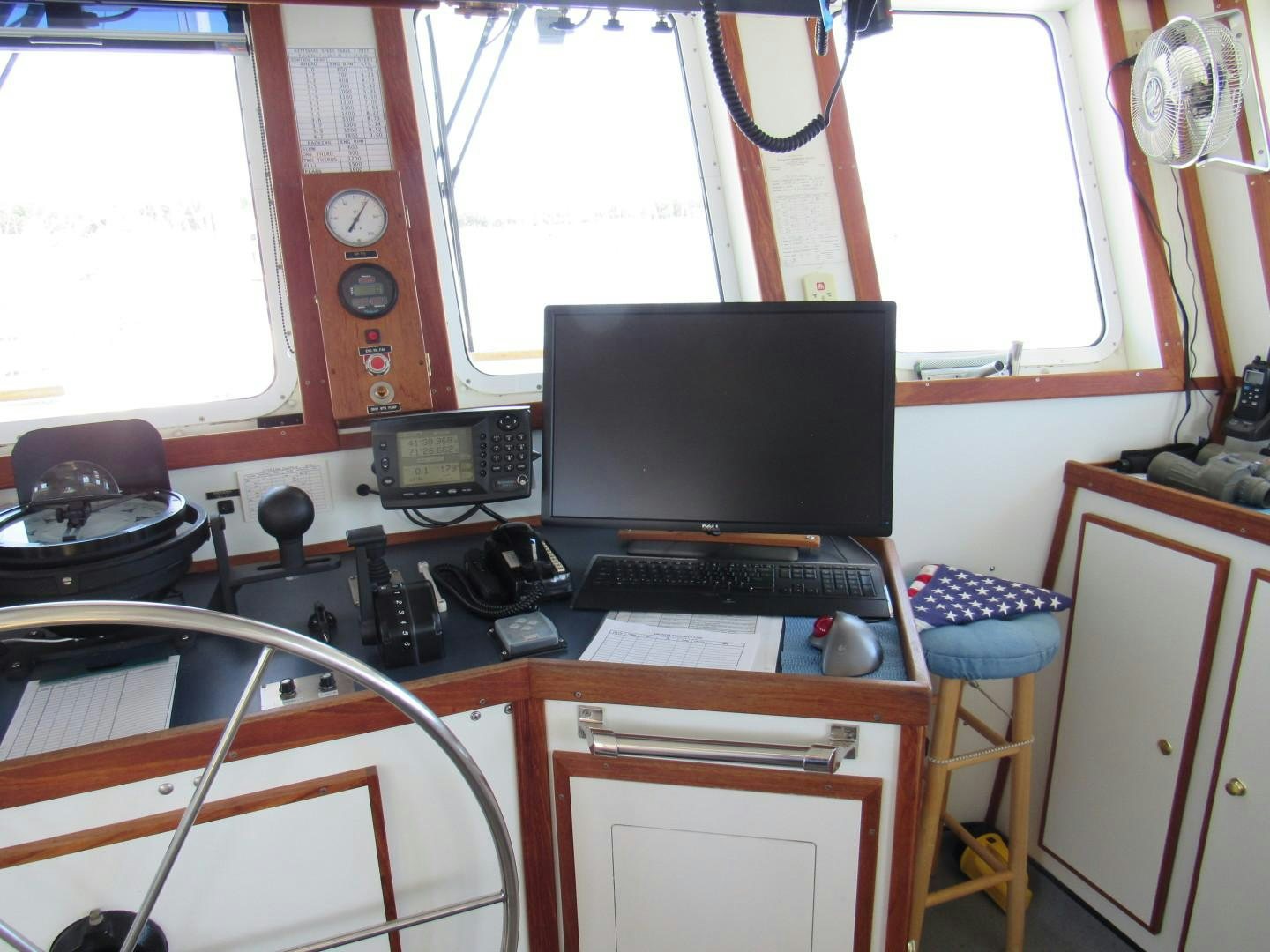 a desk with a computer and a keyboard on it aboard KITTIWAKE Yacht for Sale