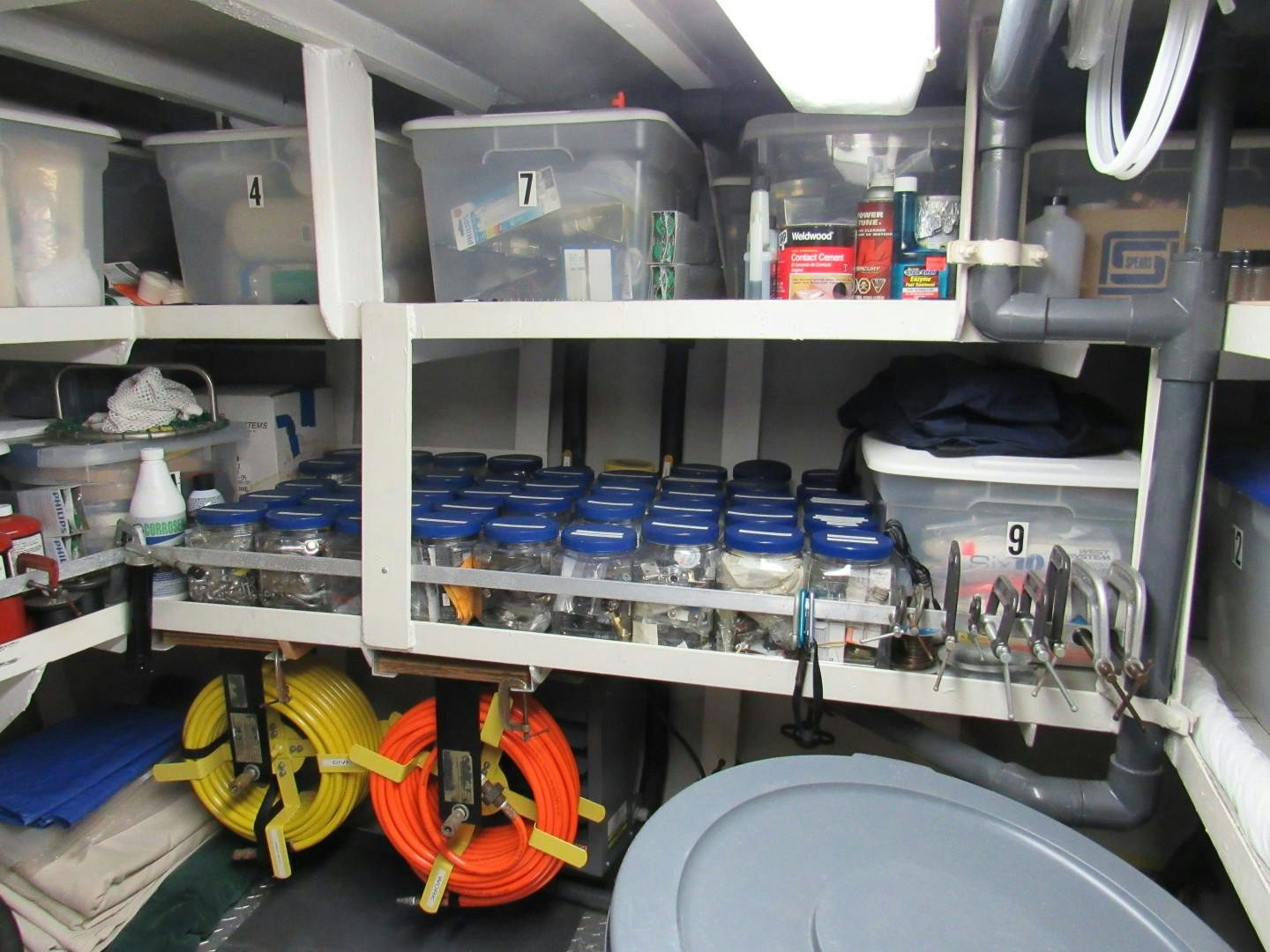 a room with shelves and equipment aboard KITTIWAKE Yacht for Sale