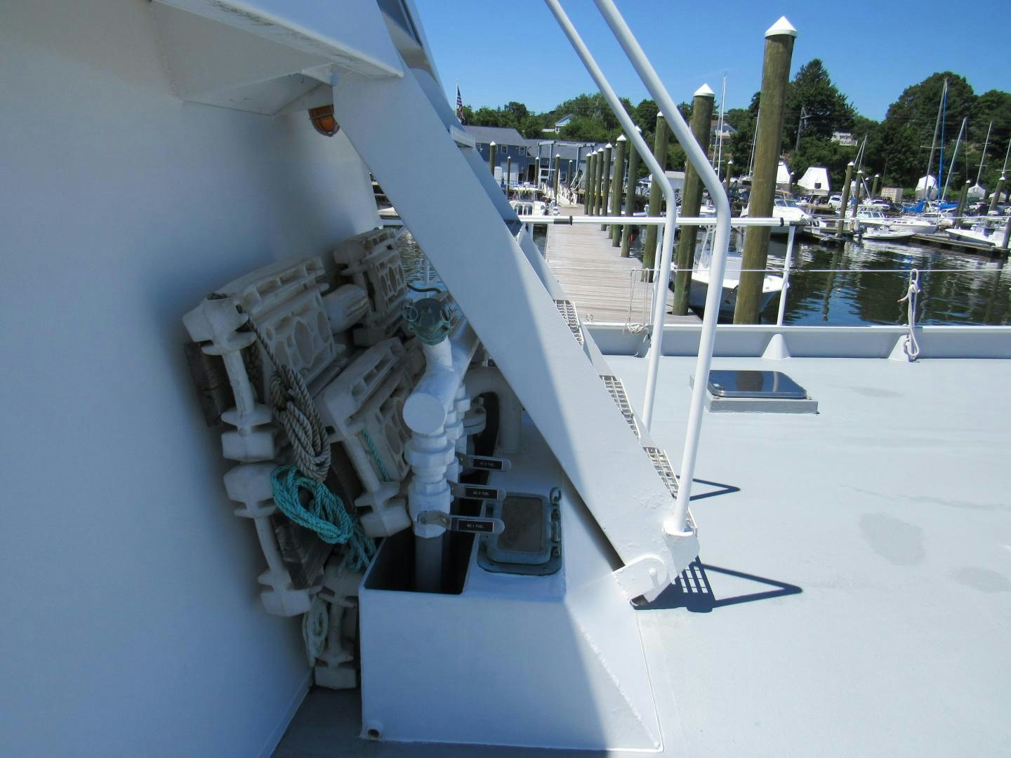 a white boat on a dock aboard KITTIWAKE Yacht for Sale