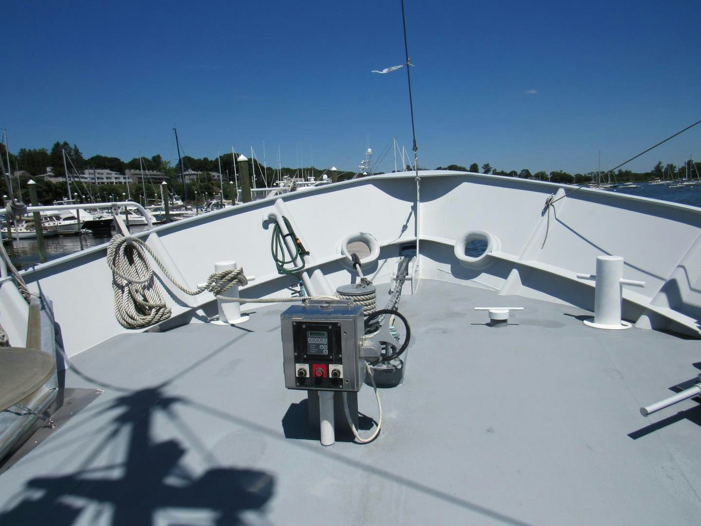 a white airplane with a black object on the front aboard KITTIWAKE Yacht for Sale