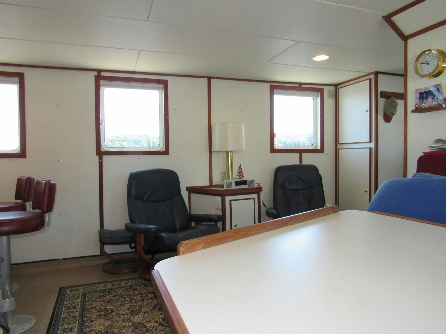 a bedroom with a bed and a desk aboard KITTIWAKE Yacht for Sale