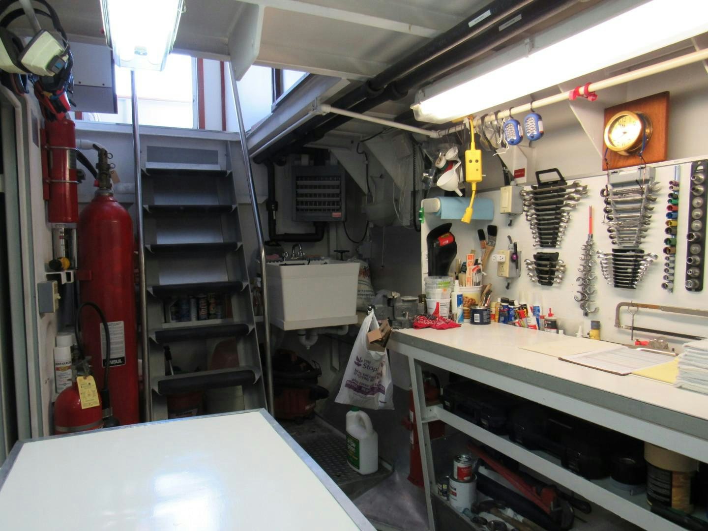 a room with shelves and equipment aboard KITTIWAKE Yacht for Sale