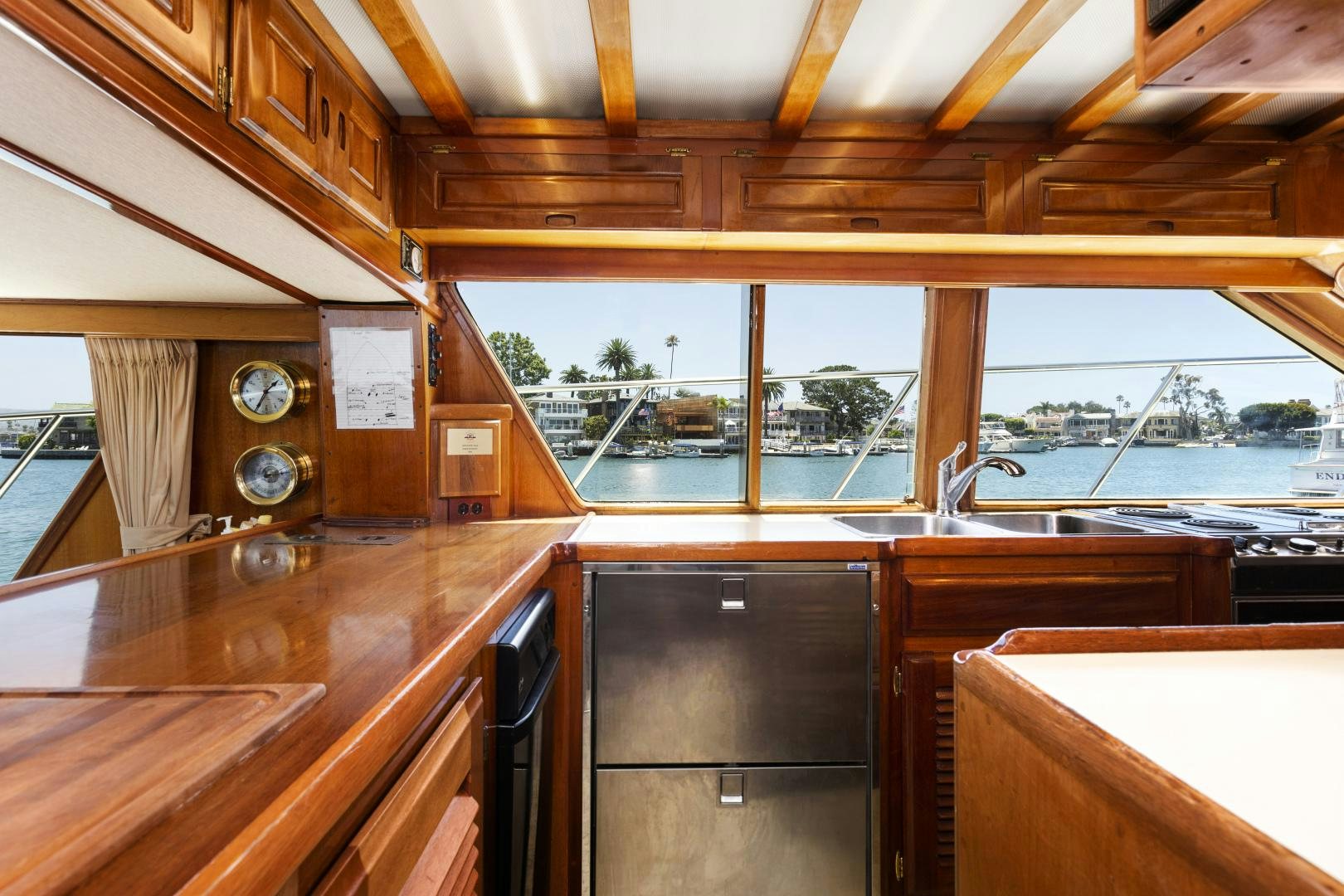 a wood table in a room aboard EL AMO Yacht for Sale