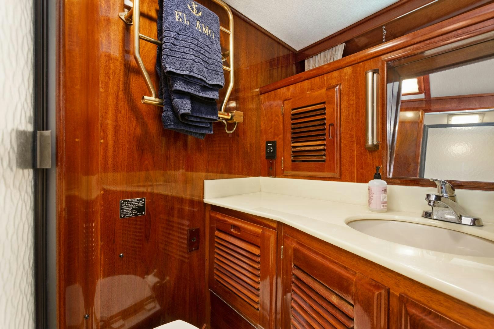 a bathroom with a towel on the wall aboard EL AMO Yacht for Sale