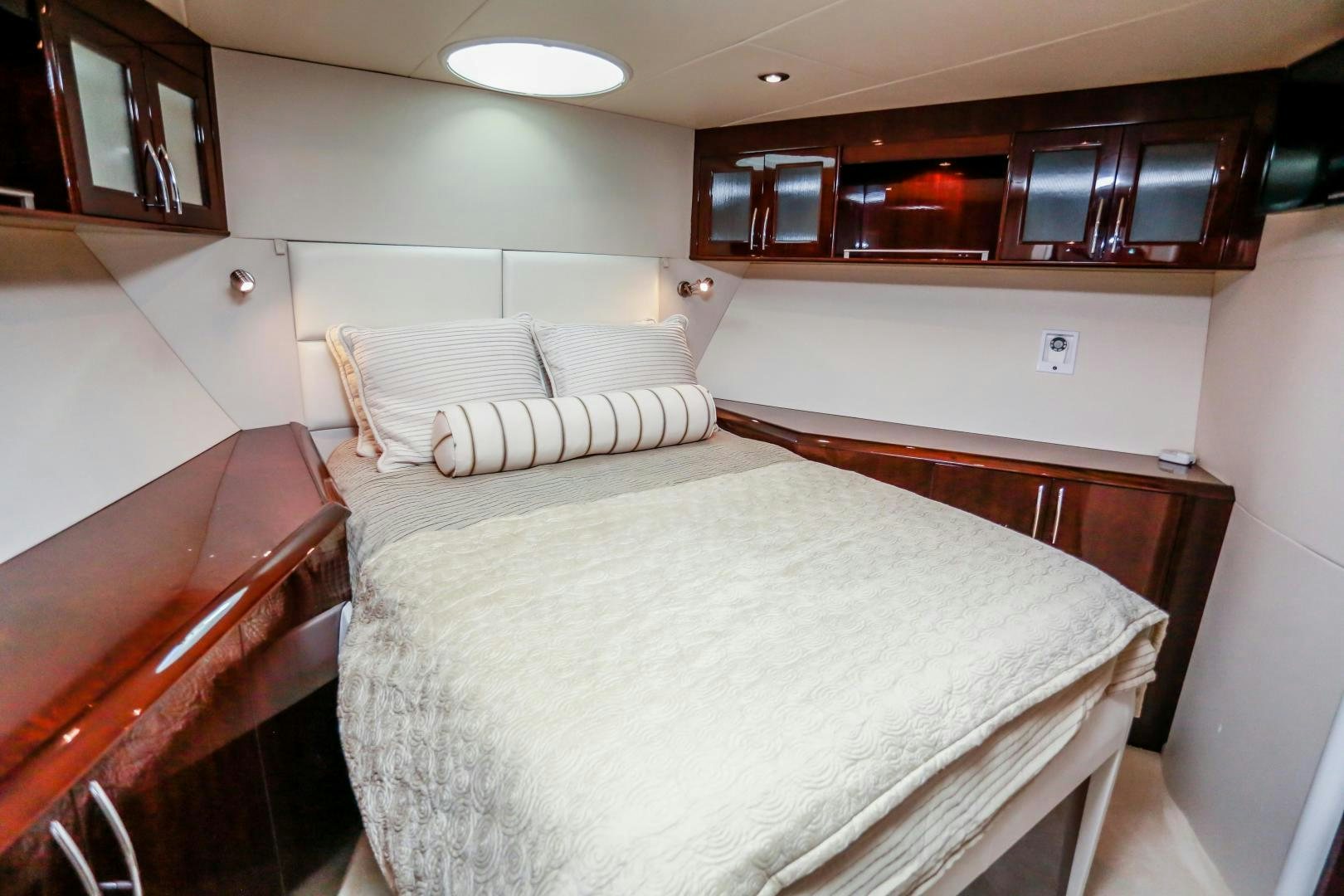 a room with a bed and a chair aboard TEREZA Yacht for Sale