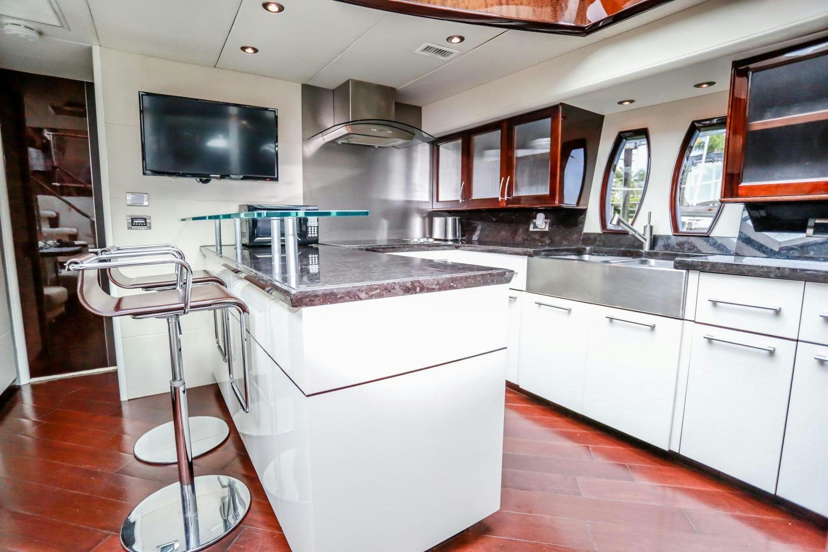 a kitchen with white cabinets aboard TEREZA Yacht for Sale