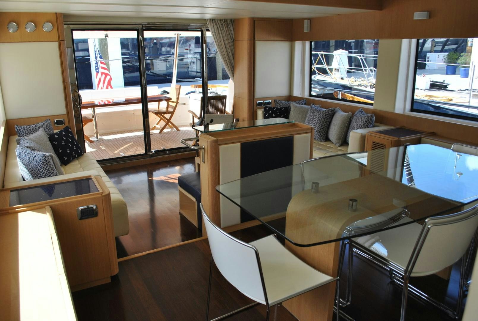 a room with a table chairs and a window aboard KRYSKAR Yacht for Sale