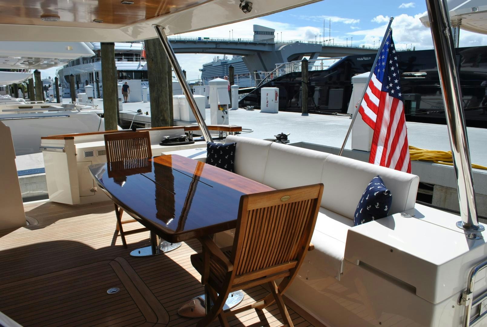 a pool table and chairs on a deck aboard KRYSKAR Yacht for Sale