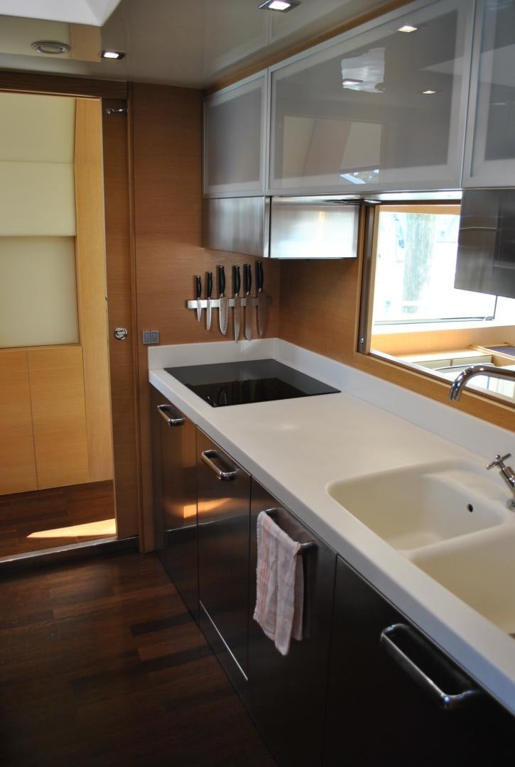 a kitchen with a sink and cabinets aboard KRYSKAR Yacht for Sale