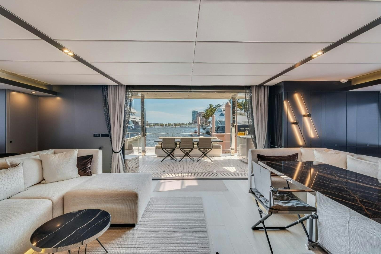 a room with a large window and a view of the ocean aboard OCEAN VIBES Yacht for Sale