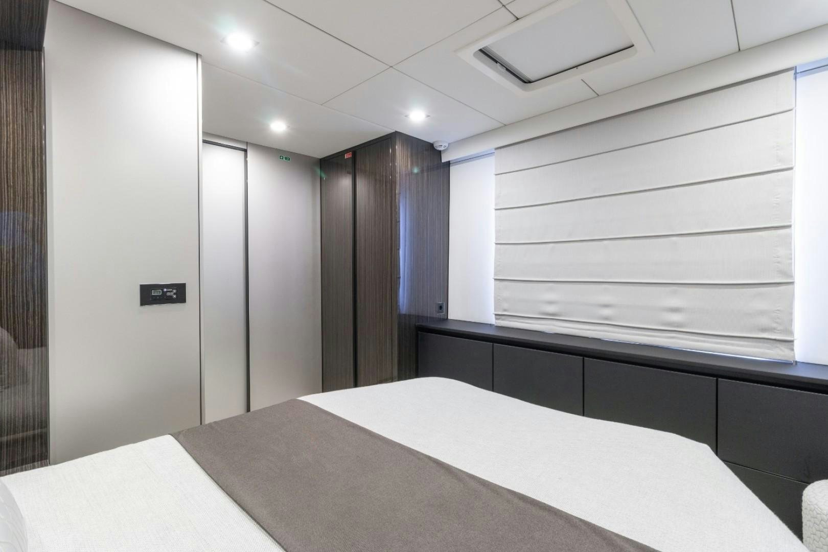 a room with a table and a window aboard OCEAN VIBES Yacht for Sale