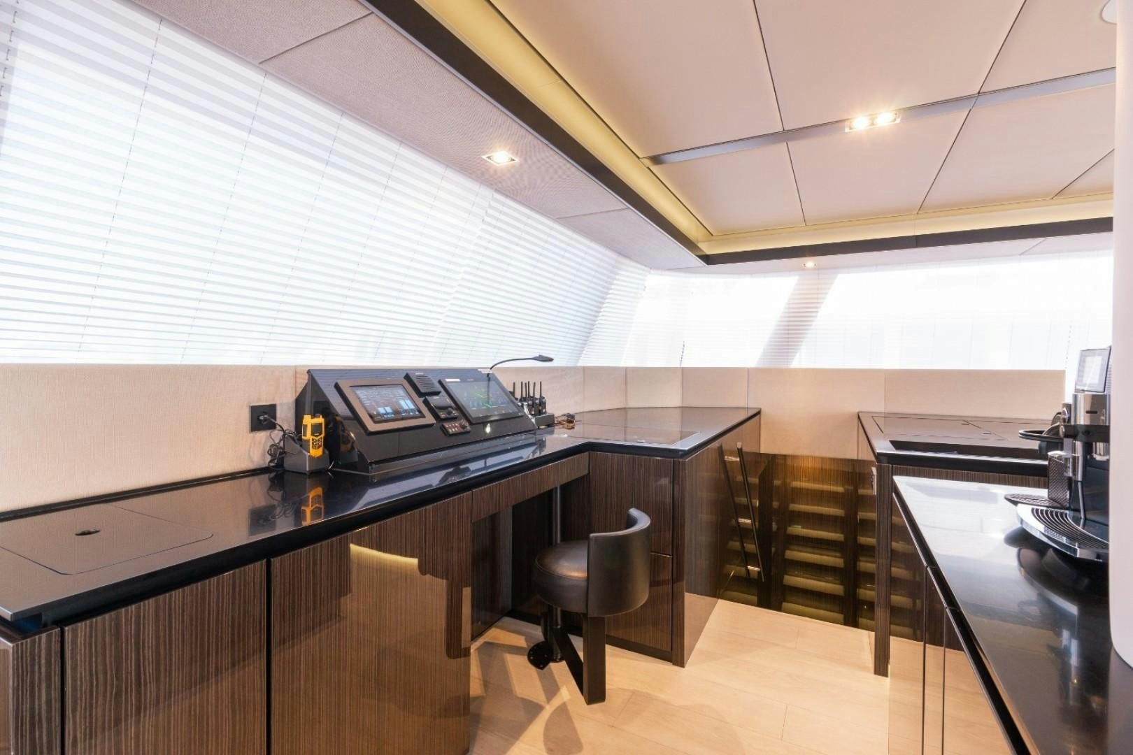 a room with a desk and a computer aboard OCEAN VIBES Yacht for Sale
