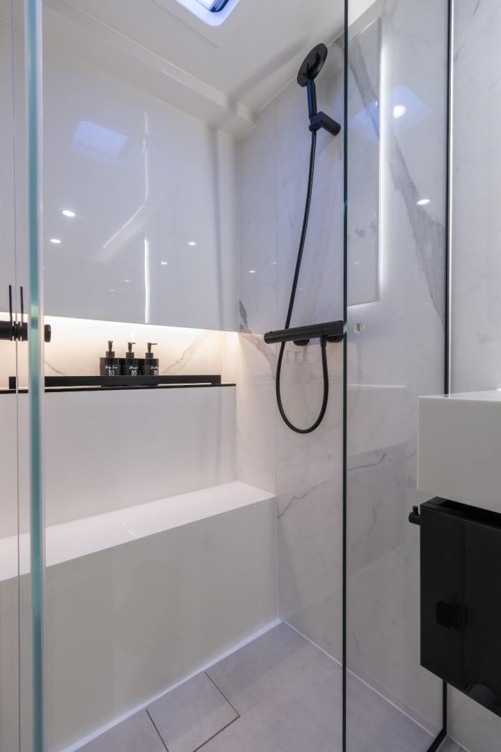 a shower unit with a glass door aboard OCEAN VIBES Yacht for Sale