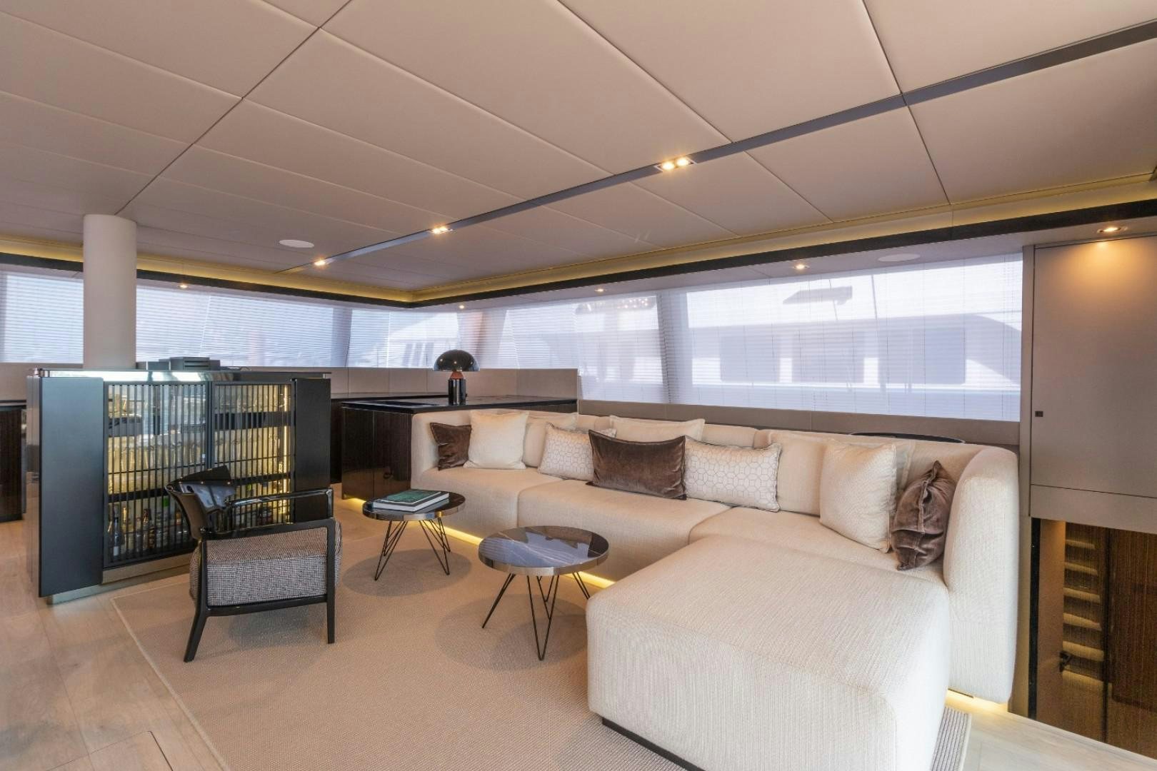 a room with a couch and a table and chairs aboard OCEAN VIBES Yacht for Sale