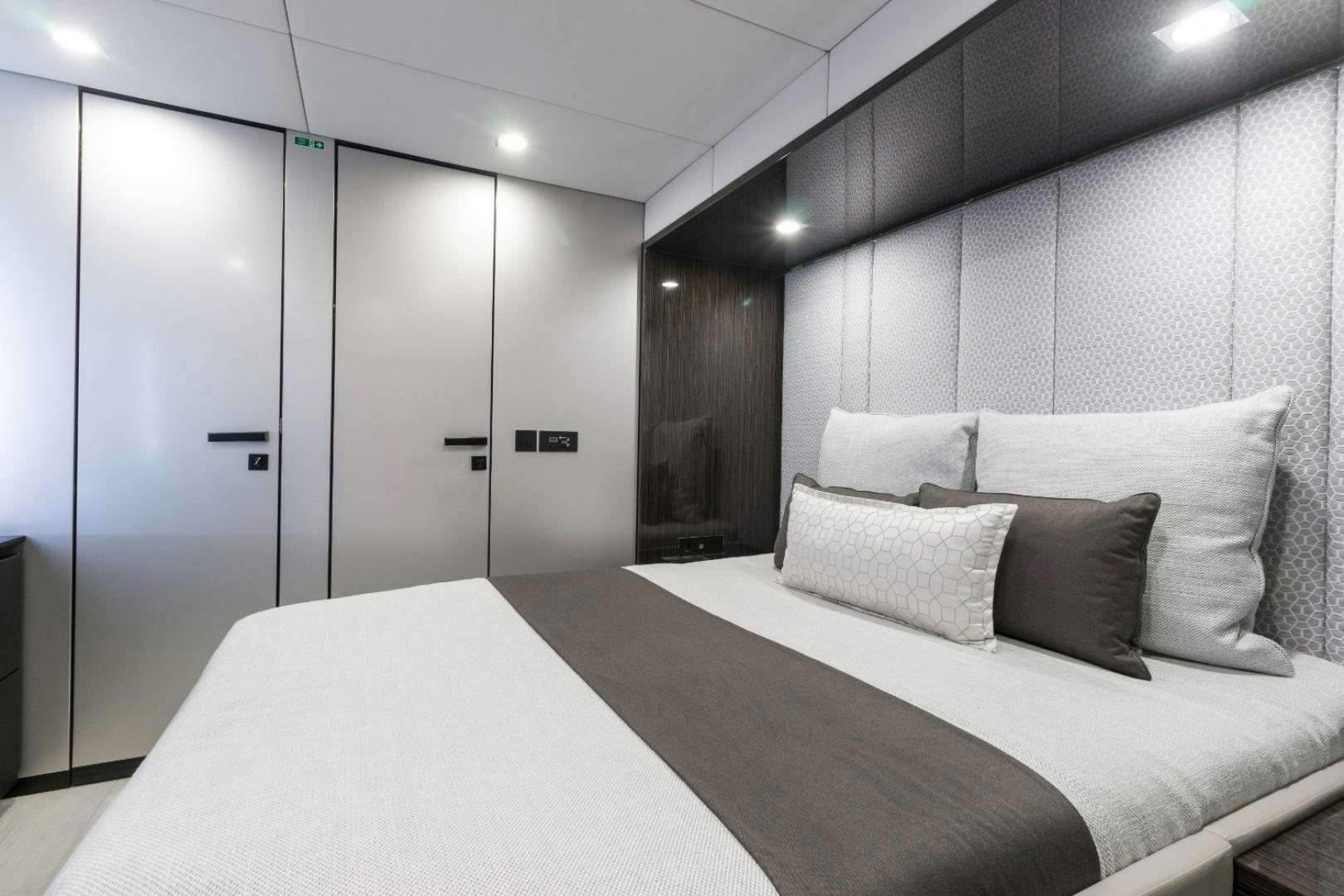 a hotel room with a bed aboard OCEAN VIBES Yacht for Sale