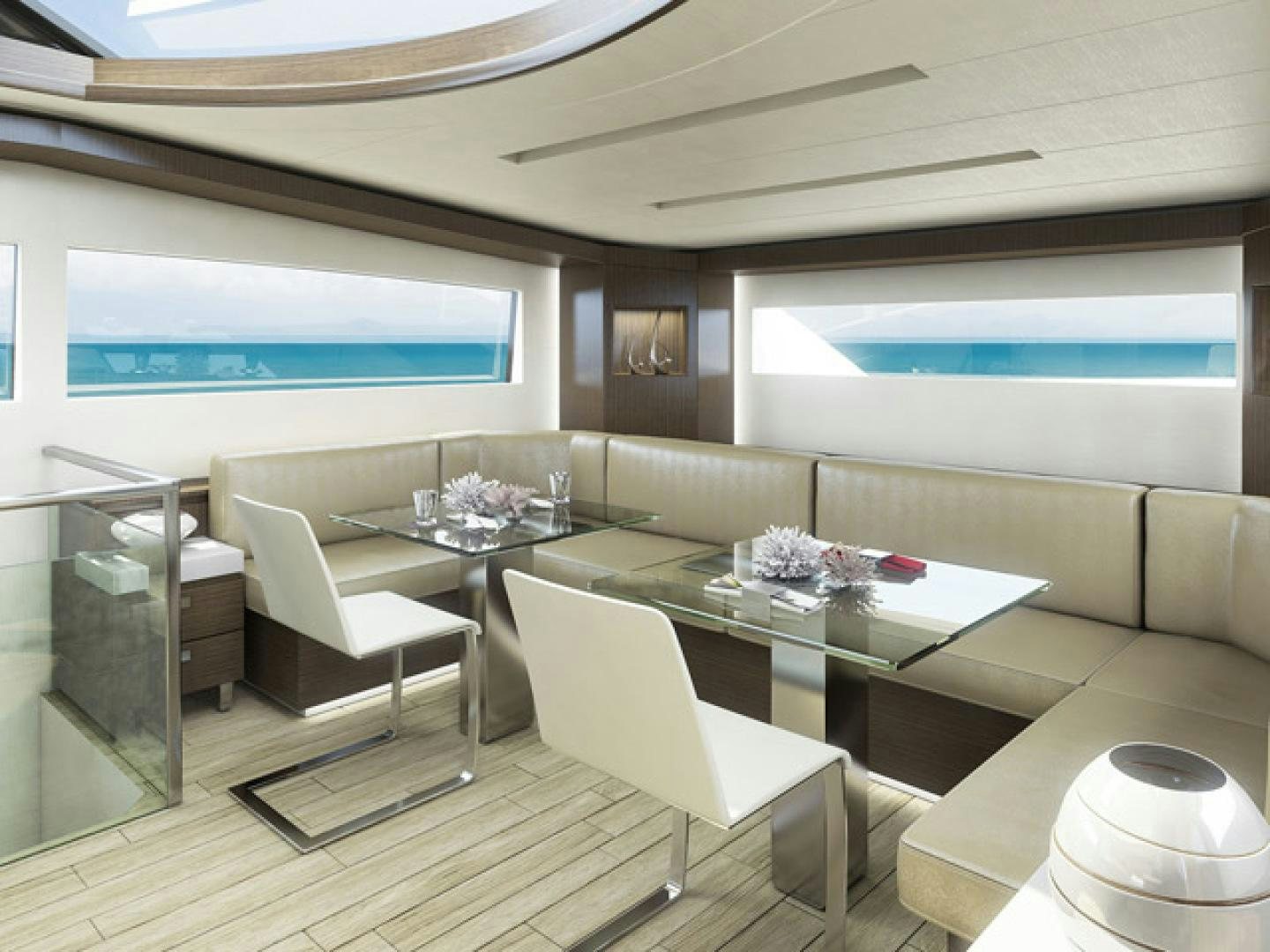 a room with a table chairs and a large screen aboard No Name Yacht for Sale