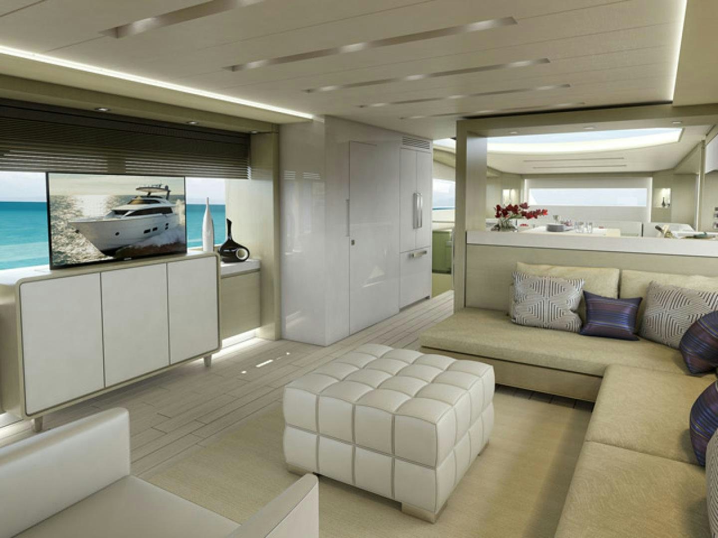 a living room with a couch and a television aboard No Name Yacht for Sale