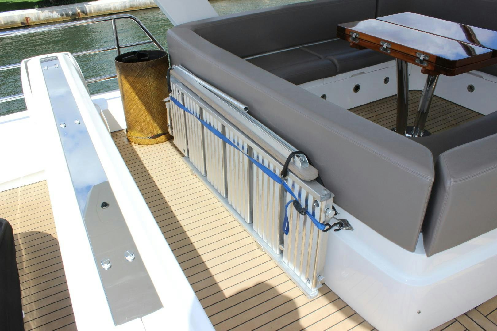 a white car with a blue stripe aboard GEMINI Yacht for Sale