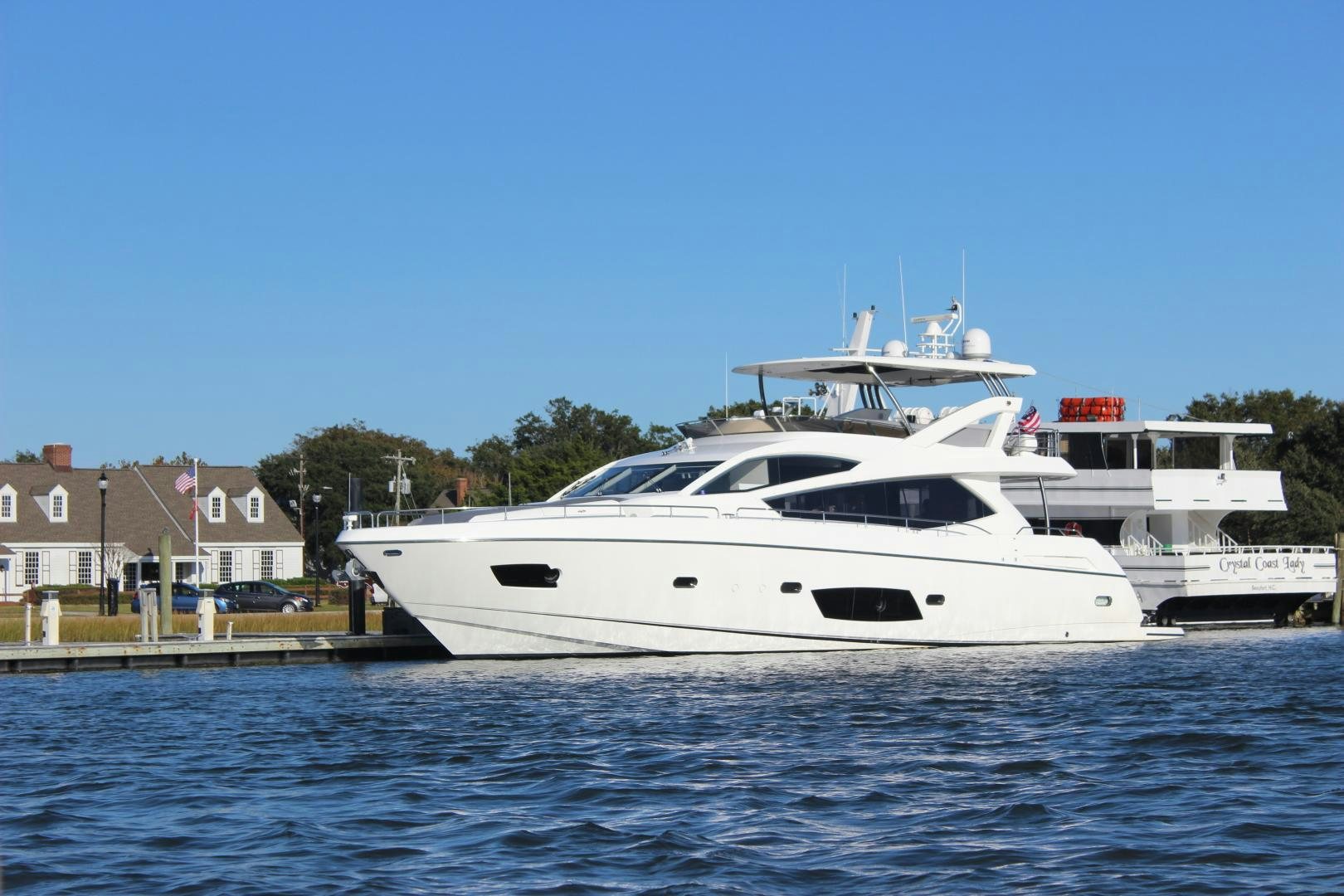 a white yacht in the water aboard GEMINI Yacht for Sale