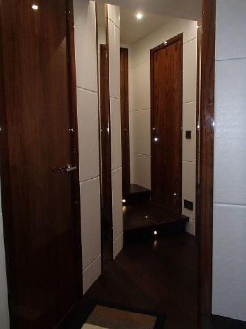 a hallway with doors aboard GEMINI Yacht for Sale