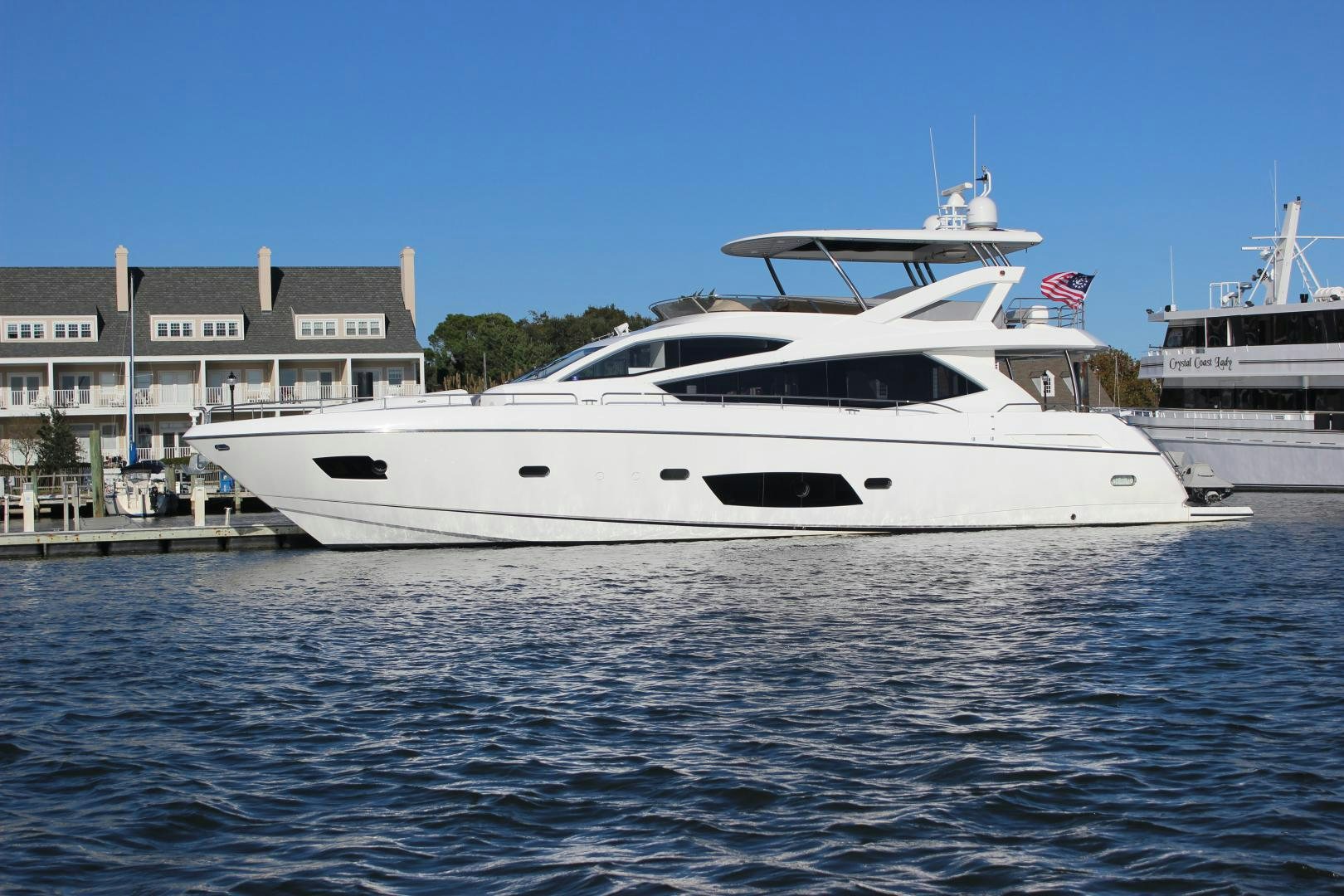 a white yacht in the water aboard GEMINI Yacht for Sale