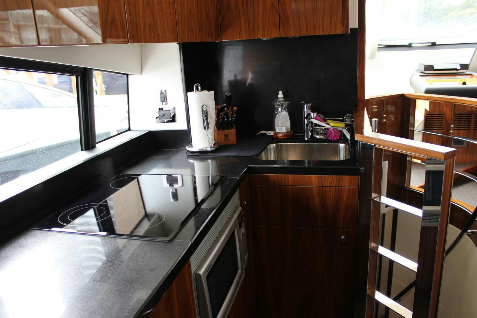 a kitchen with a sink and cabinets aboard GEMINI Yacht for Sale