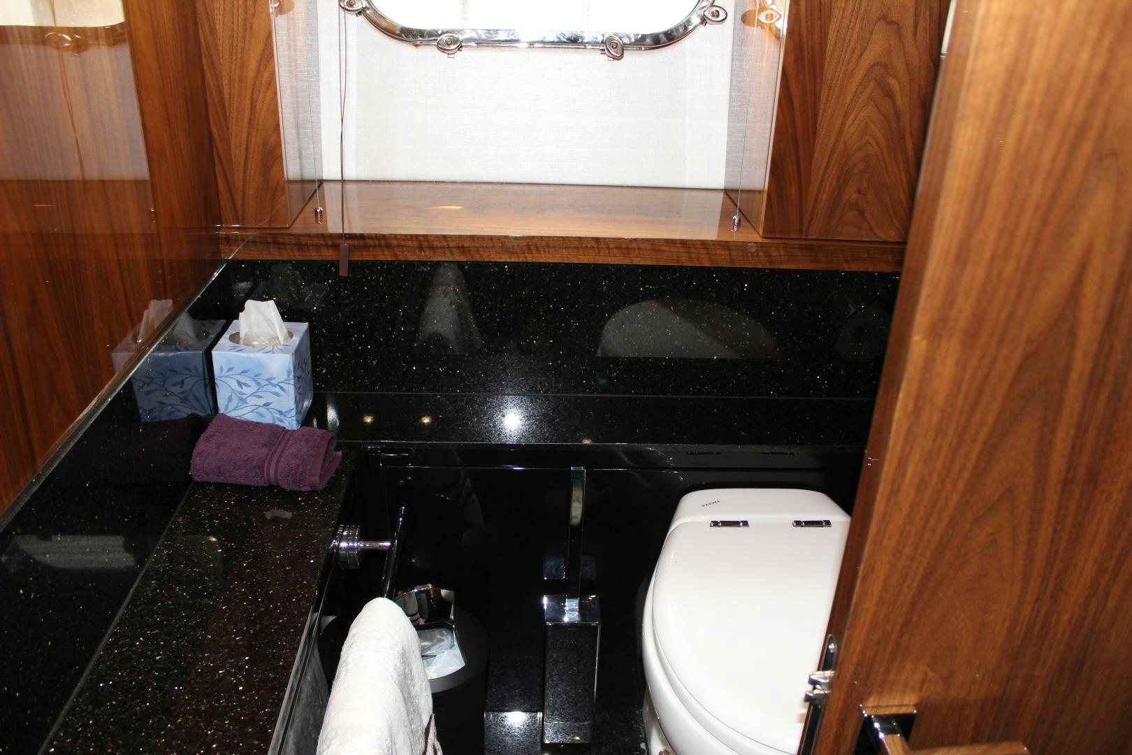 a bathroom with a black countertop aboard GEMINI Yacht for Sale