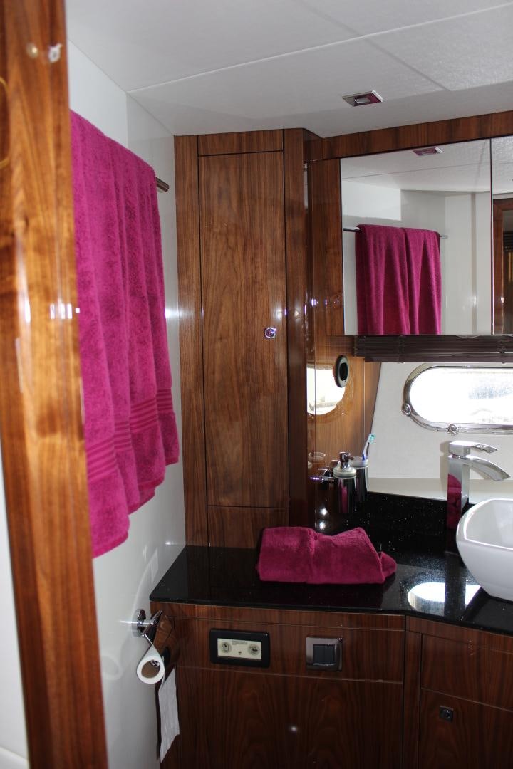 a bathroom with a sink and a mirror aboard GEMINI Yacht for Sale