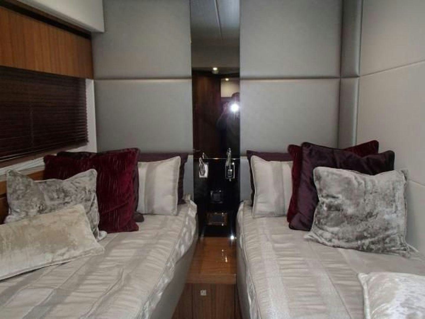 a room with two beds aboard GEMINI Yacht for Sale