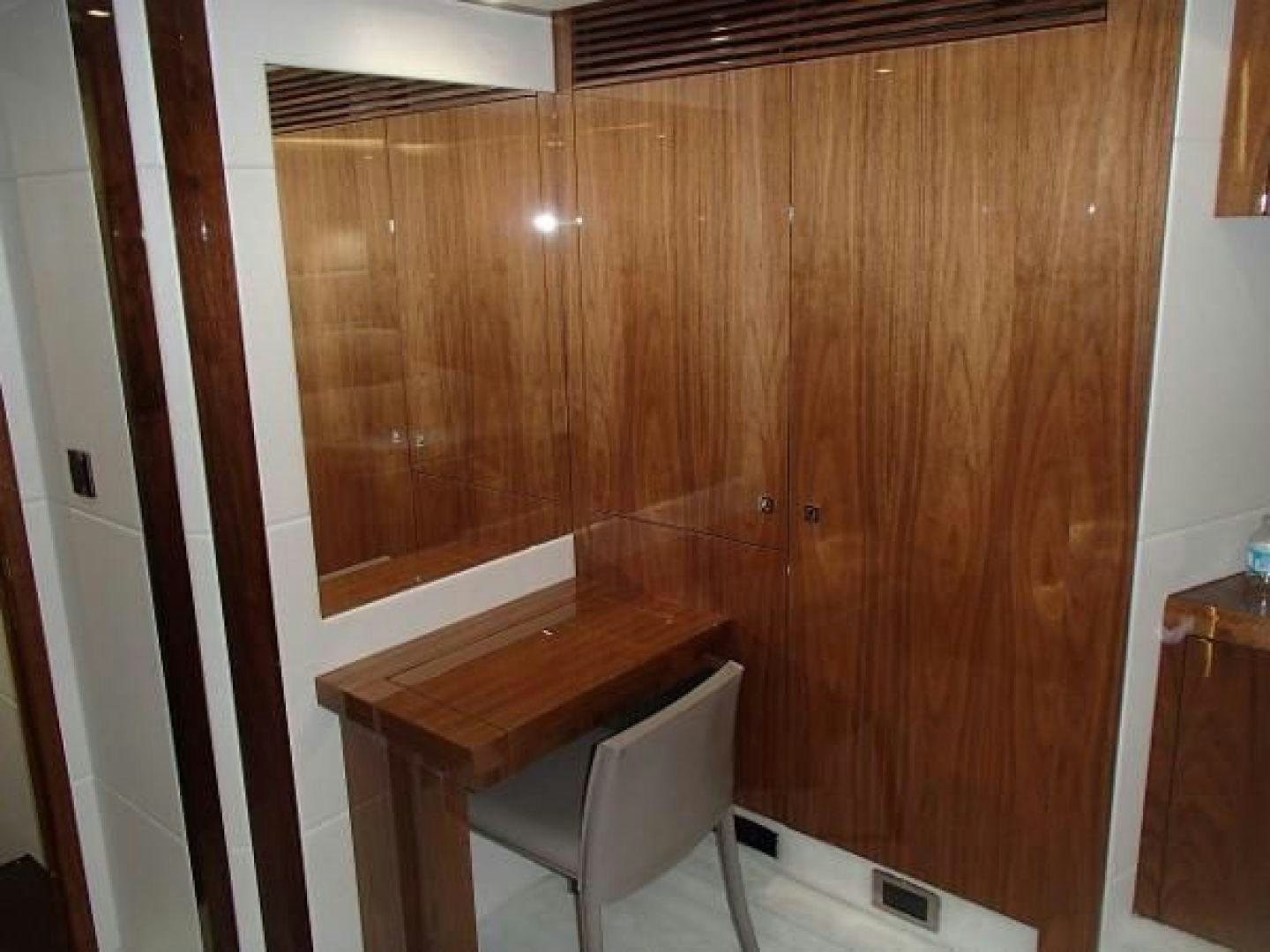 a chair next to a wooden wall aboard GEMINI Yacht for Sale