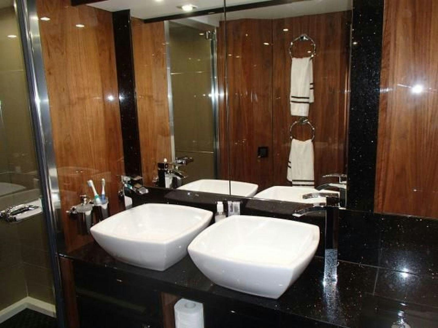 a bathroom with two sinks aboard GEMINI Yacht for Sale