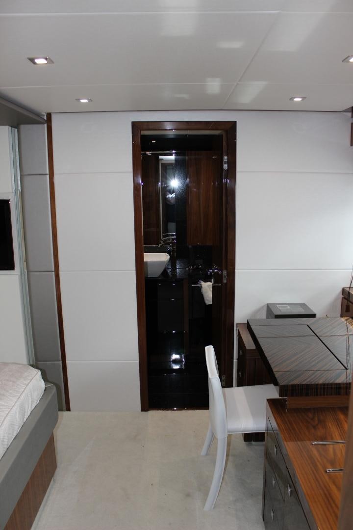 a bathroom with a black door aboard GEMINI Yacht for Sale