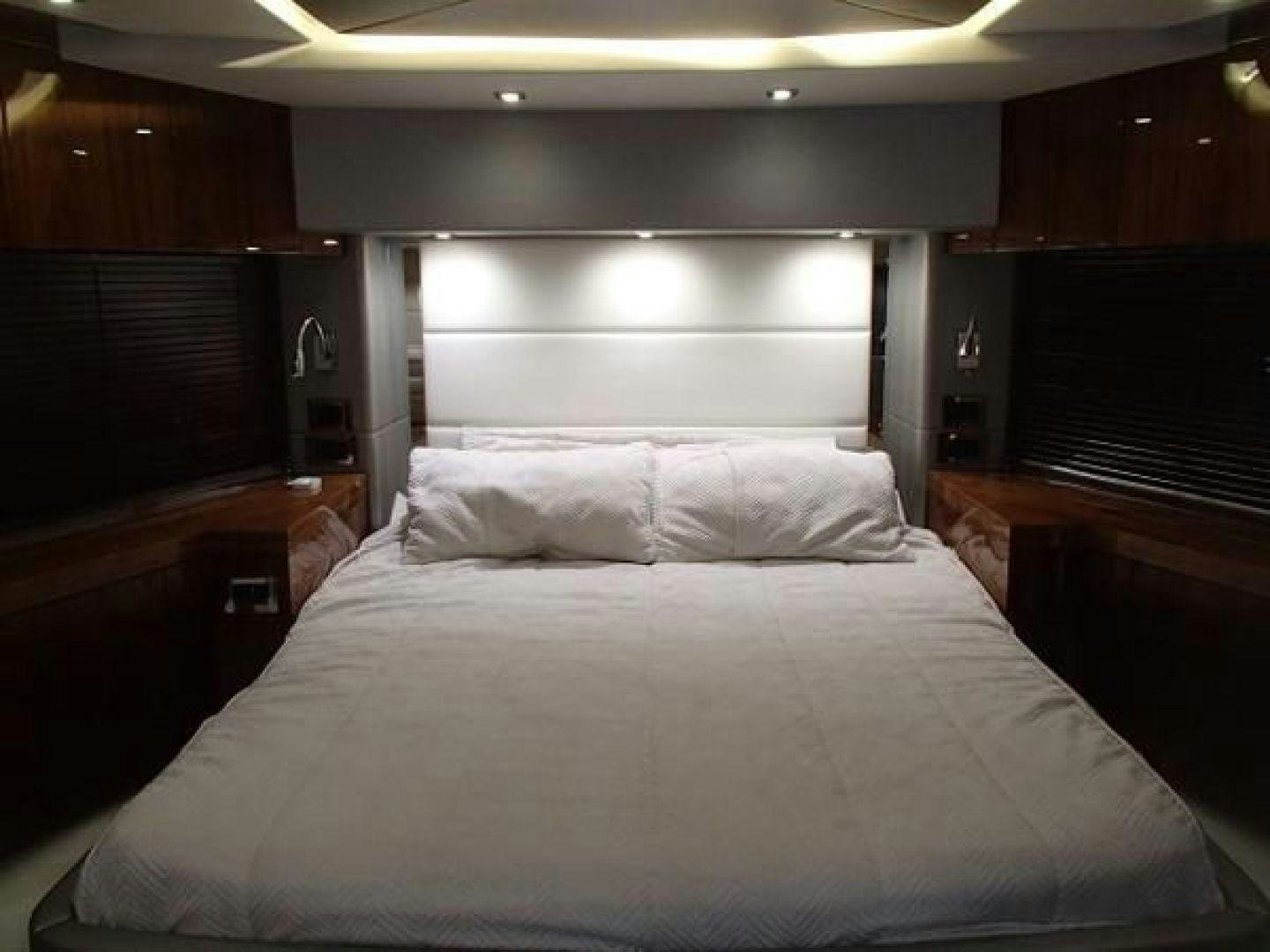 a bed with white sheets aboard GEMINI Yacht for Sale