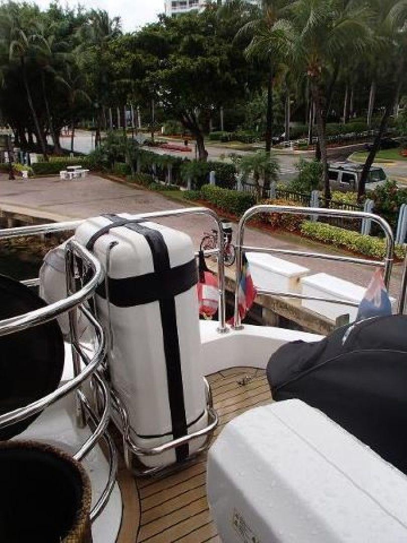 a person sitting on a porch aboard GEMINI Yacht for Sale