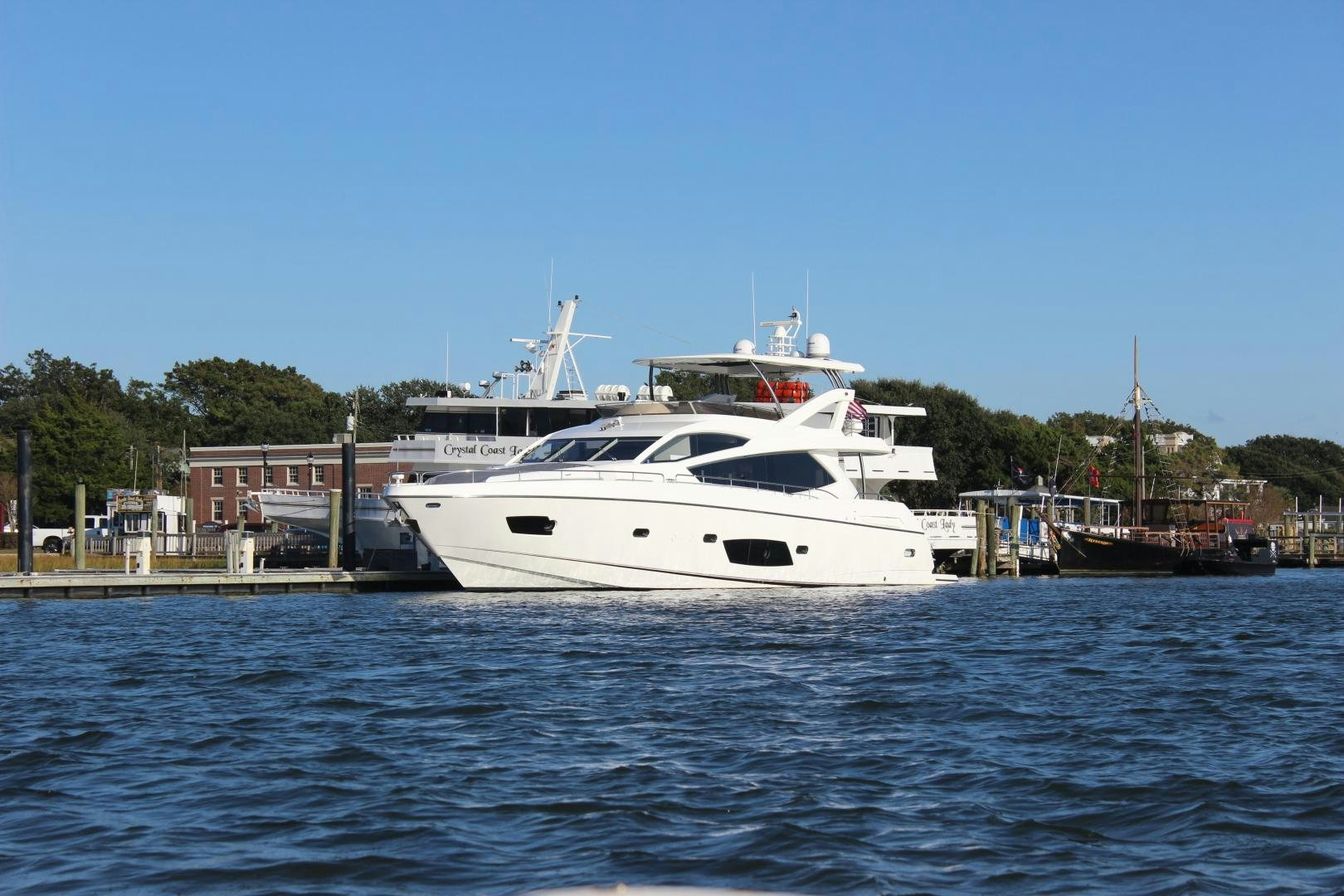 a white yacht in the water aboard GEMINI Yacht for Sale