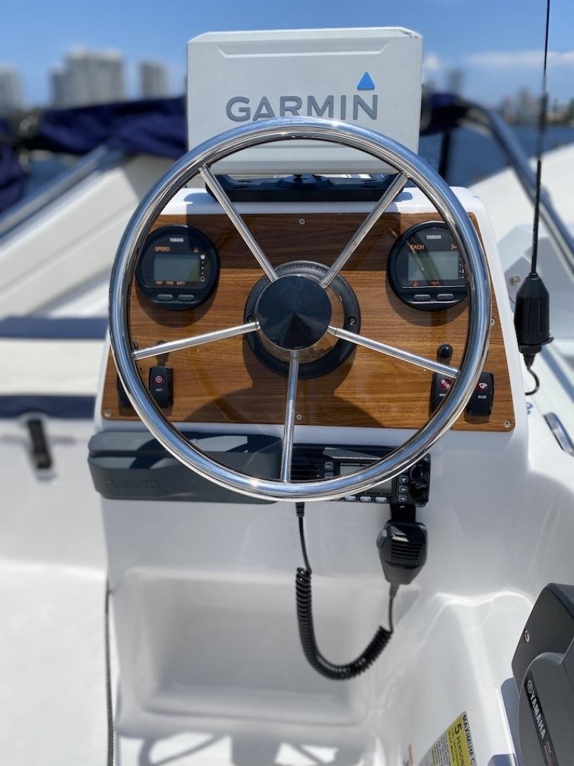 a close-up of a steering wheel aboard   Yacht for Sale