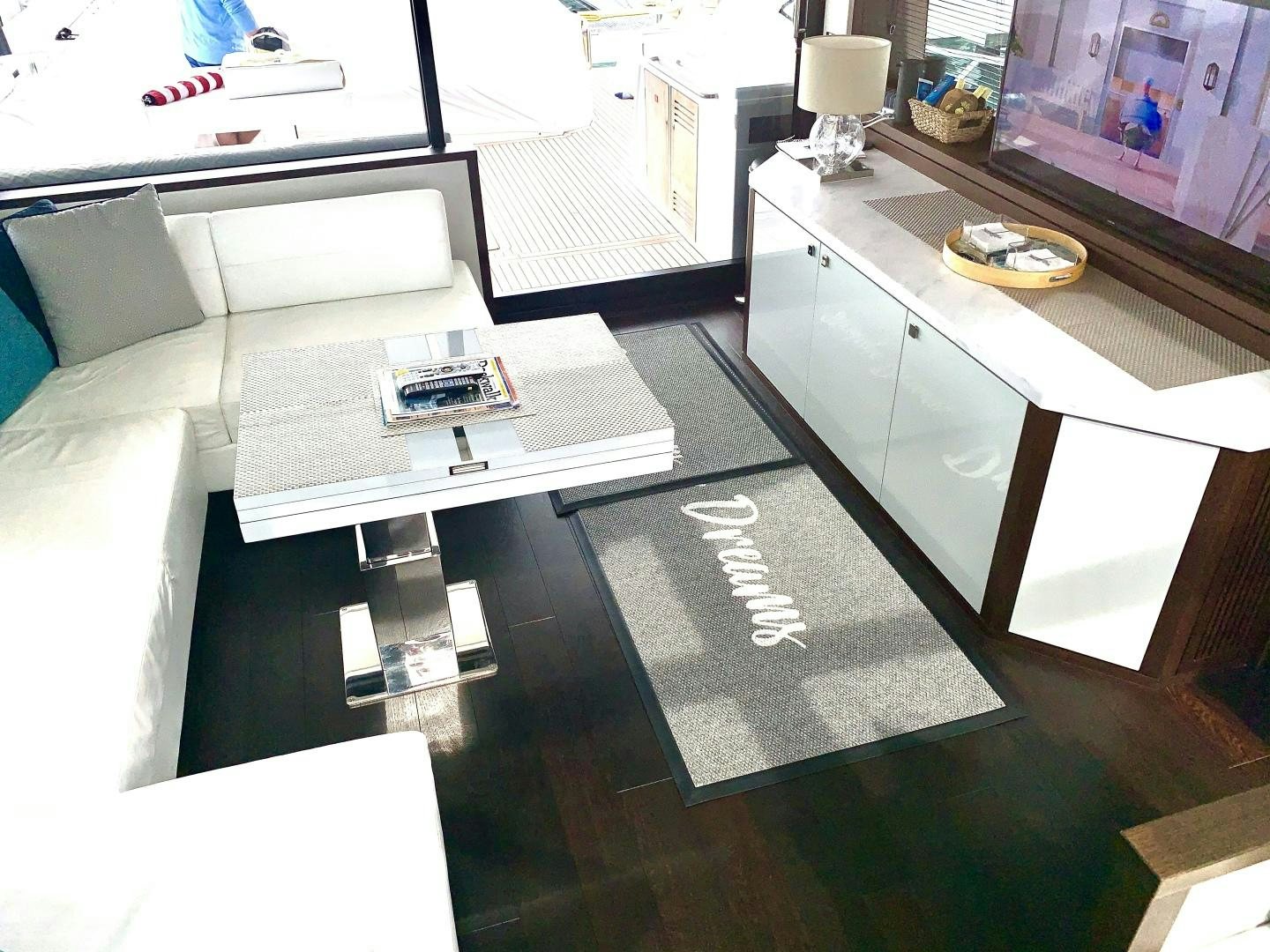 a room with a couch and a table with a computer on it aboard STRATEGIC DREAMS Yacht for Sale