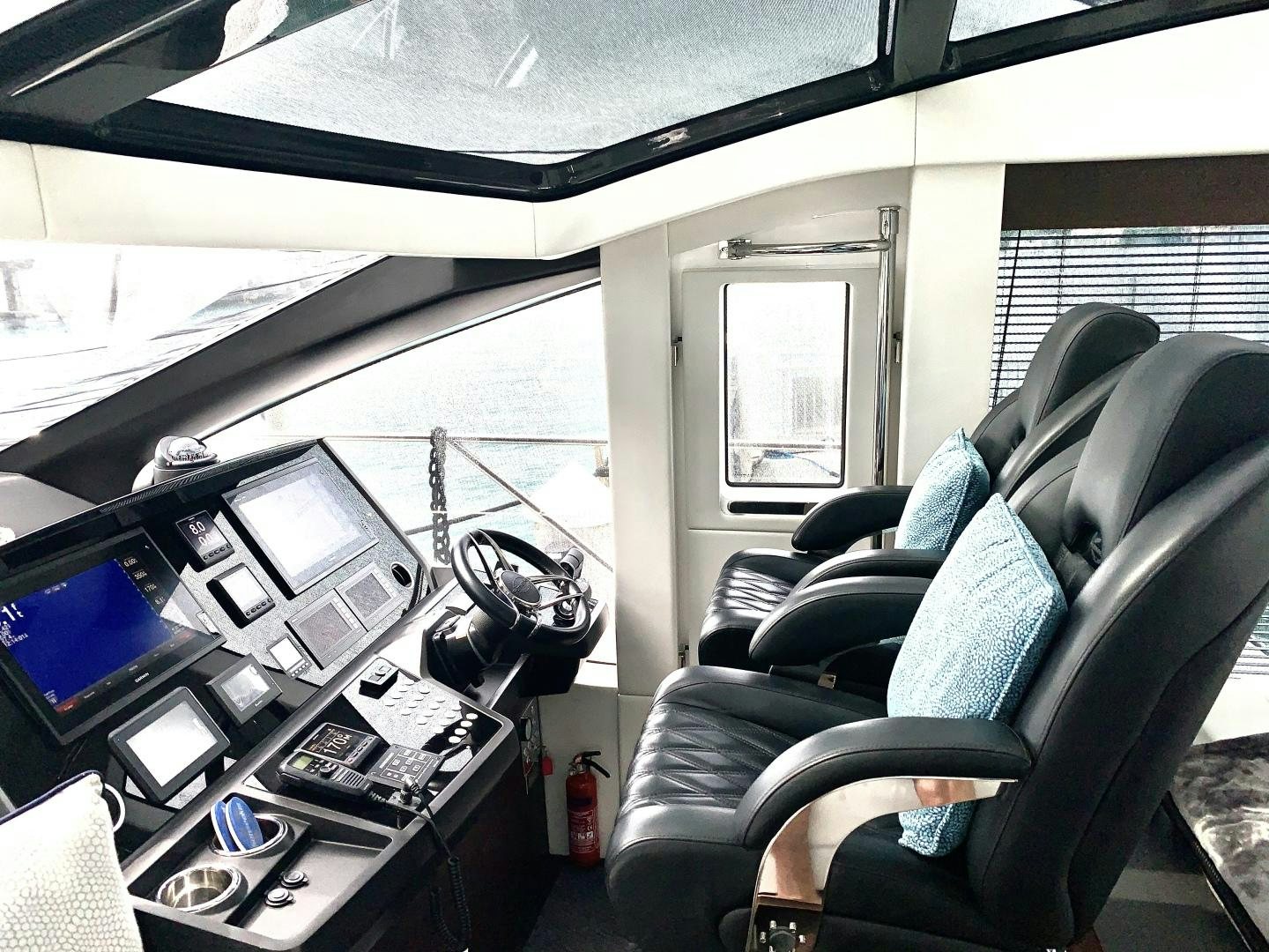a vehicle with a couple of monitors and a couple of keyboards aboard STRATEGIC DREAMS Yacht for Sale