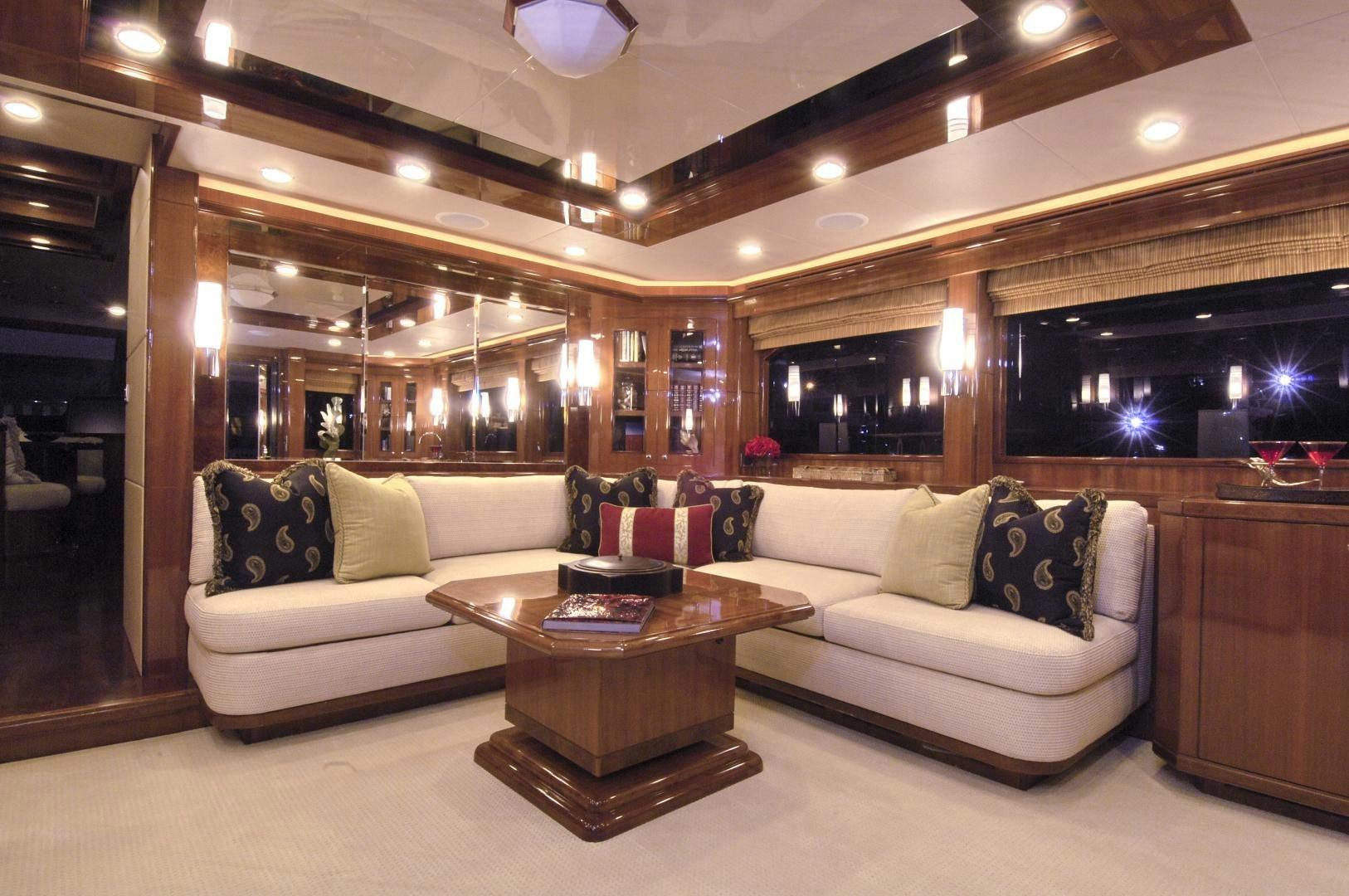 a living room with a couch and a coffee table aboard HATT TRICK Yacht for Sale
