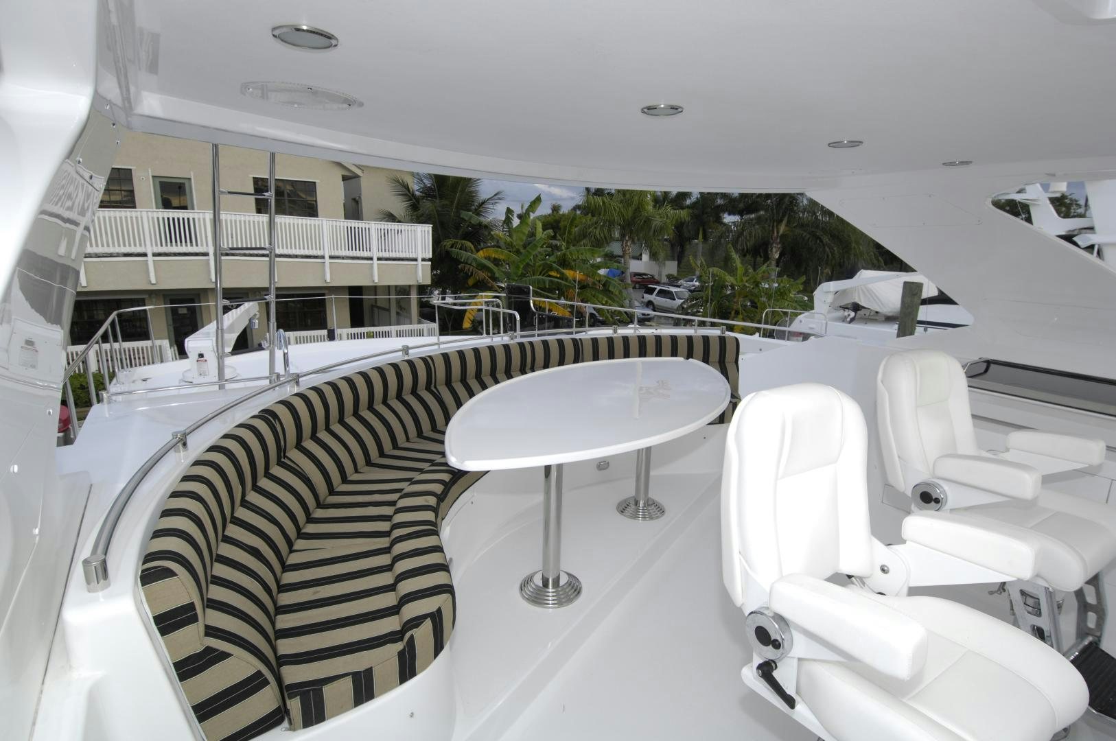 a room with a table and chairs aboard HATT TRICK Yacht for Sale