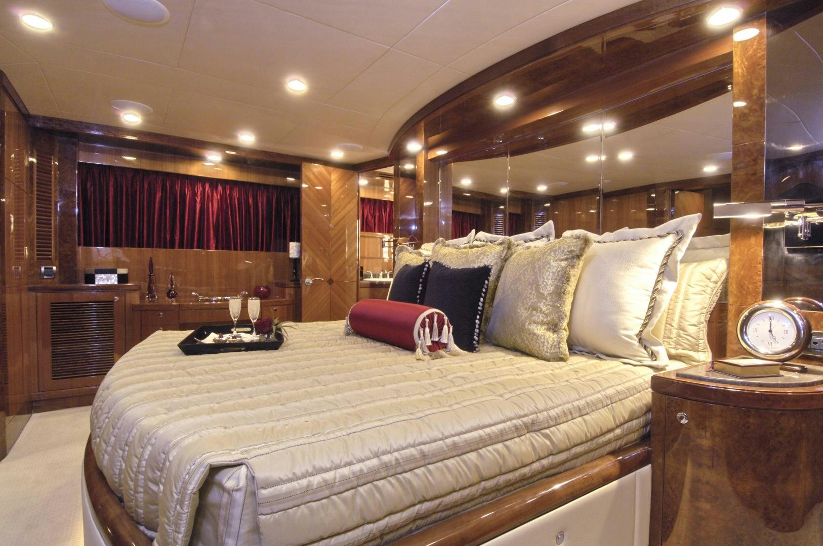 a bed with a white comforter and pillows in a hotel room aboard HATT TRICK Yacht for Sale