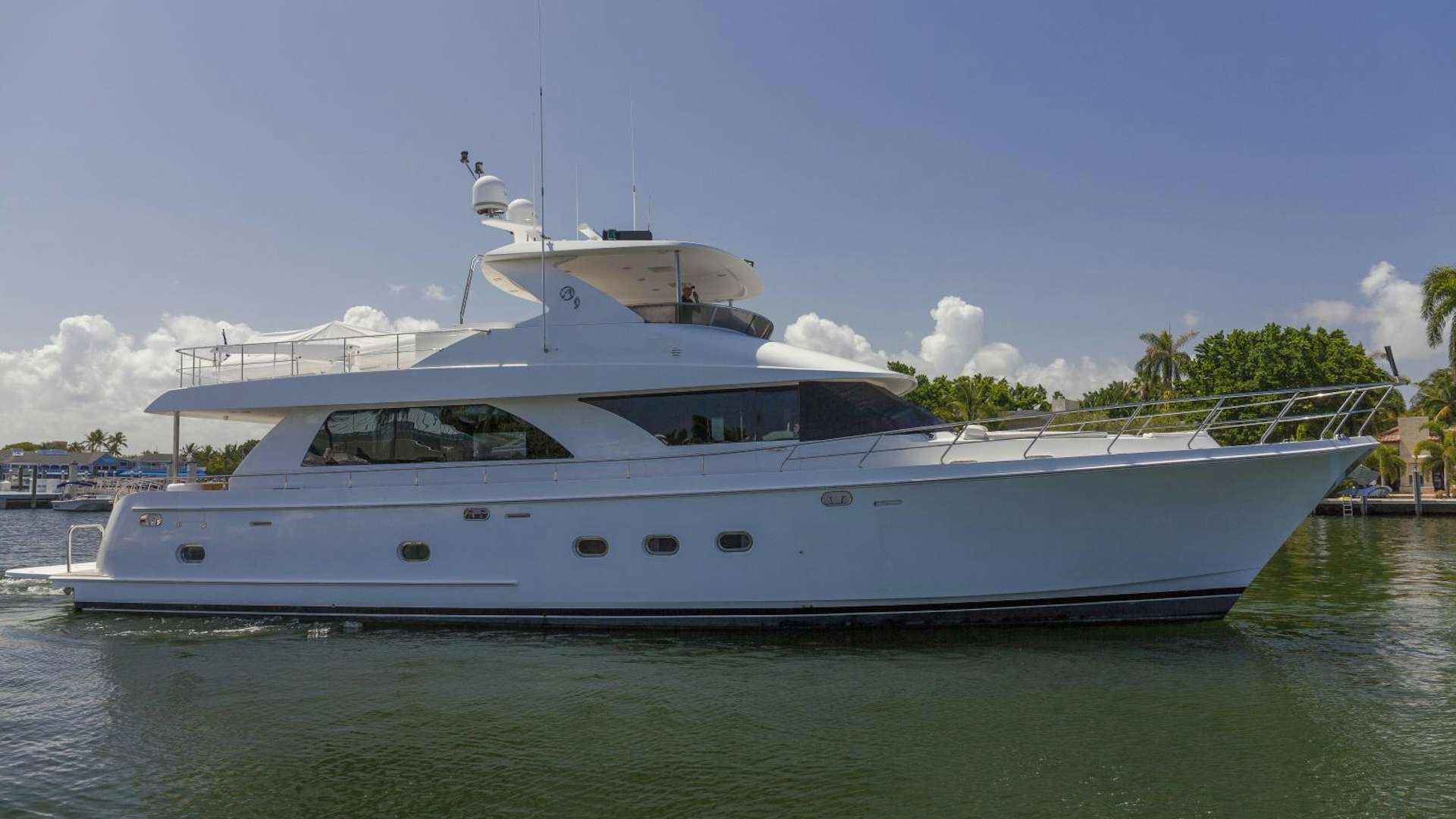 a white yacht in the water aboard HATT TRICK Yacht for Sale