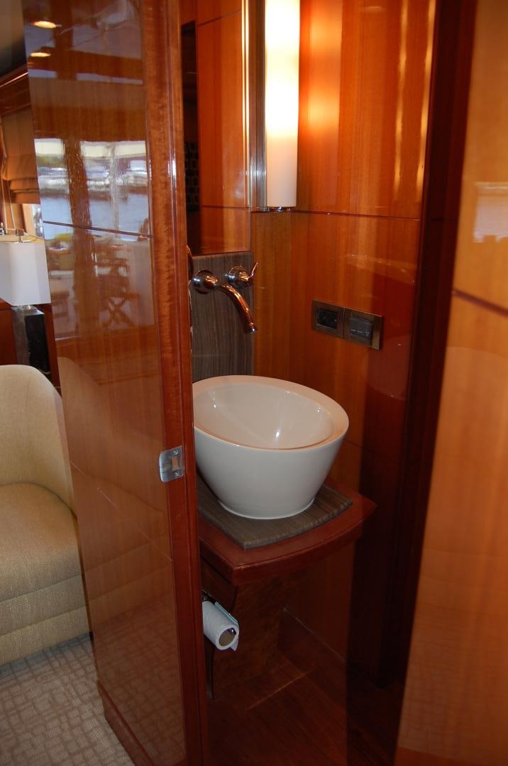 a bathroom with a sink and a mirror aboard HATT TRICK Yacht for Sale