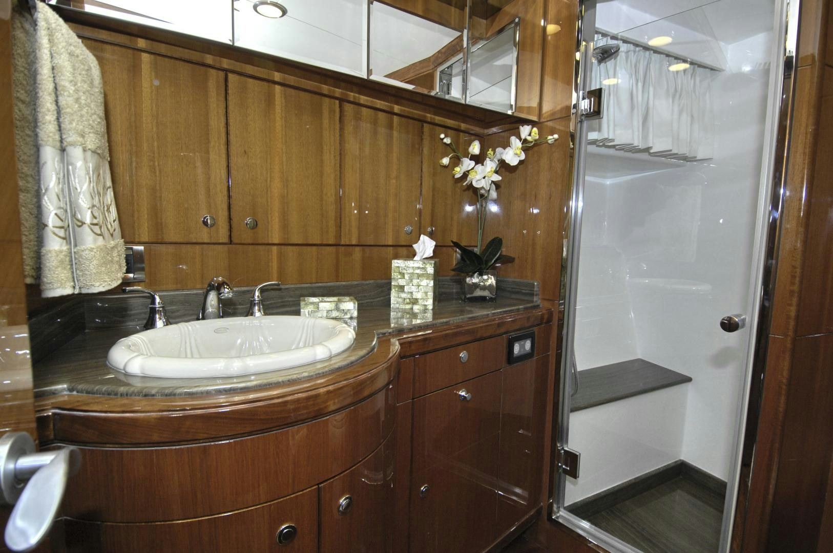 a bathroom with a sink and cabinets aboard HATT TRICK Yacht for Sale
