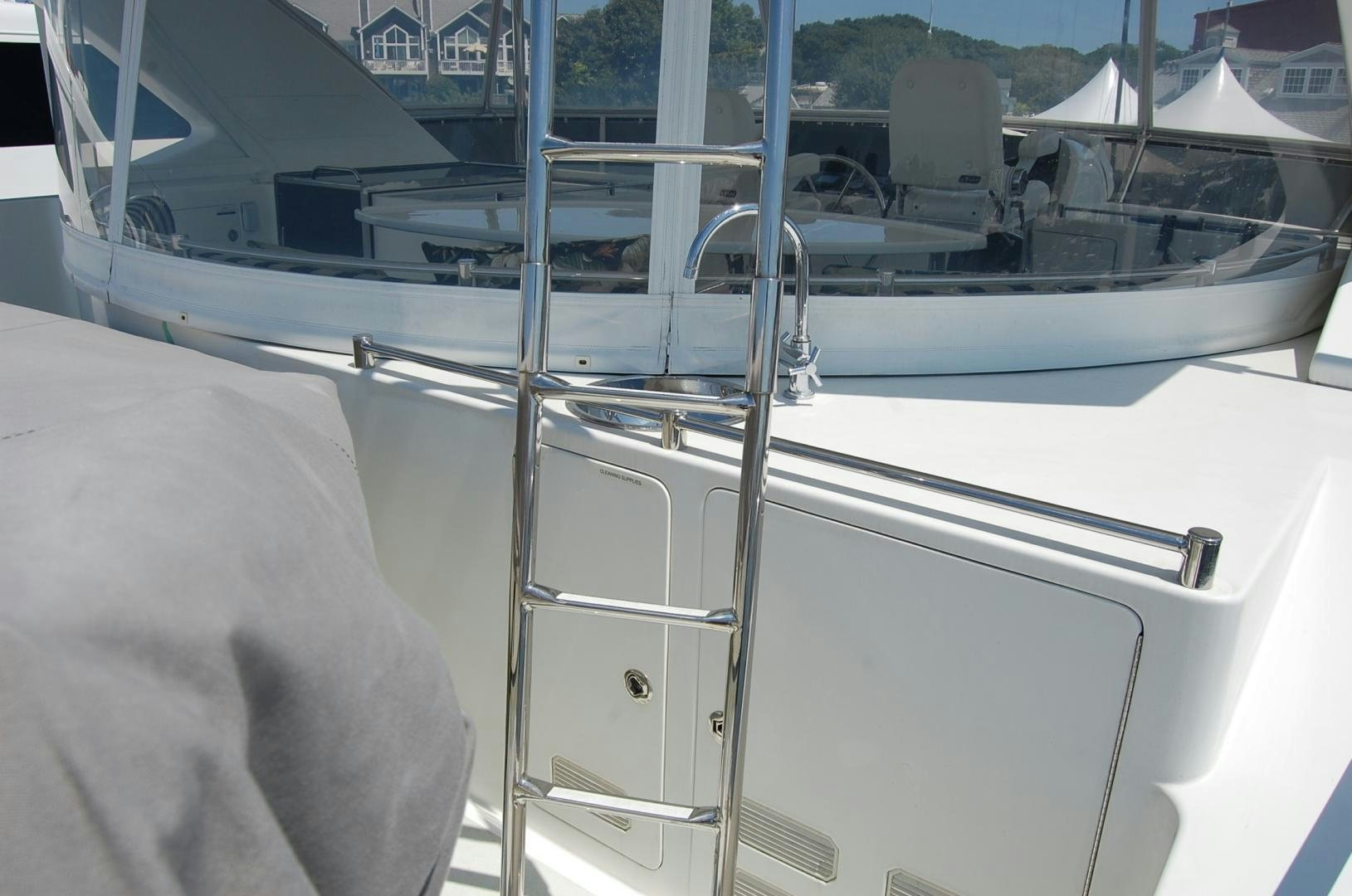 a person sitting on a boat aboard HATT TRICK Yacht for Sale