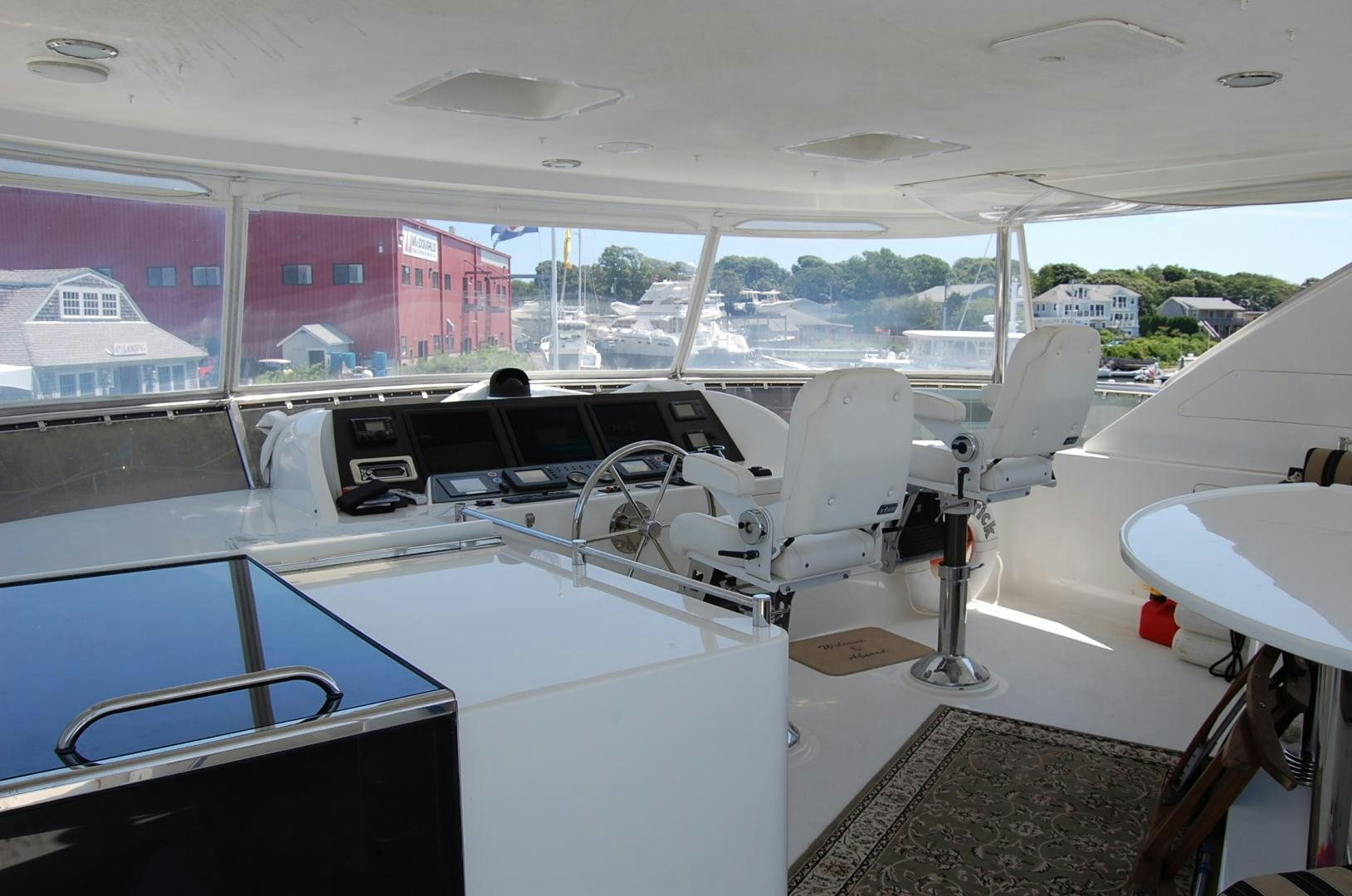 a white car with a black hood aboard HATT TRICK Yacht for Sale