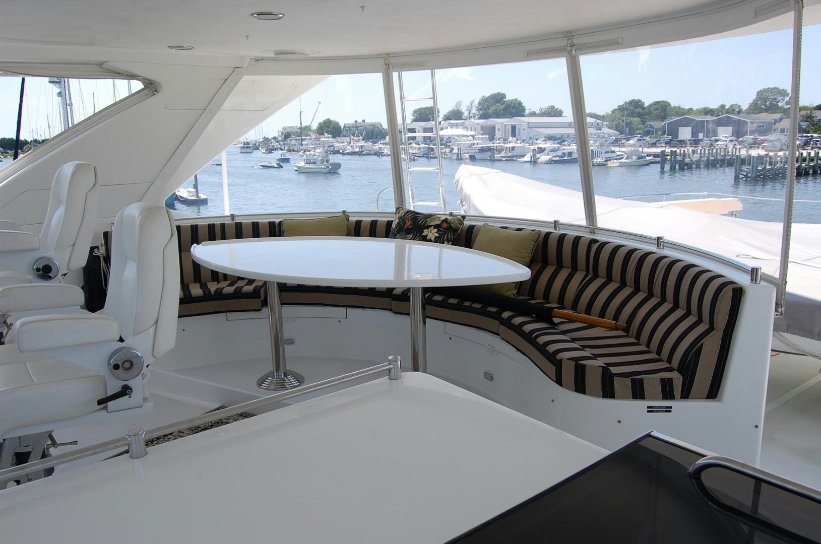 a room with a table and chairs aboard HATT TRICK Yacht for Sale