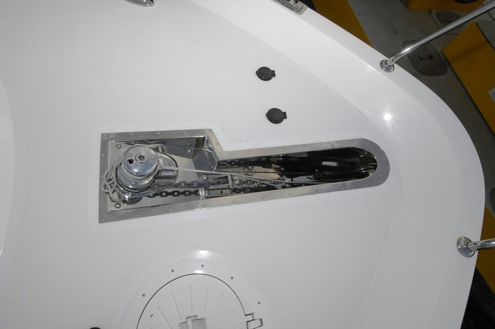 a silver faucet on a white wall aboard HATT TRICK Yacht for Sale